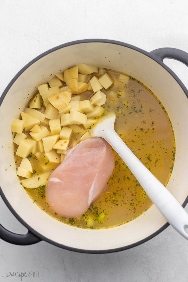 chicken breast and cubed potatoes added to pot.