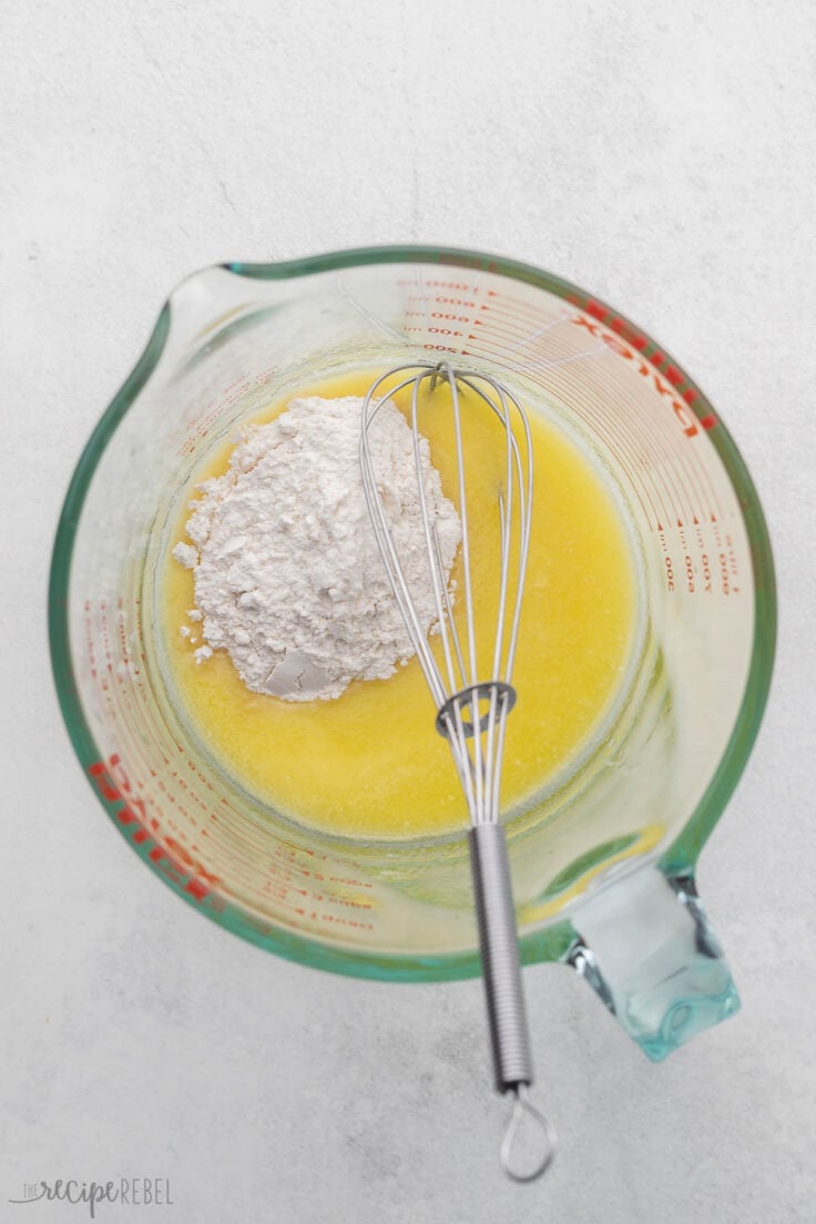 melted butter and flour in glass measuring cup with whisk.