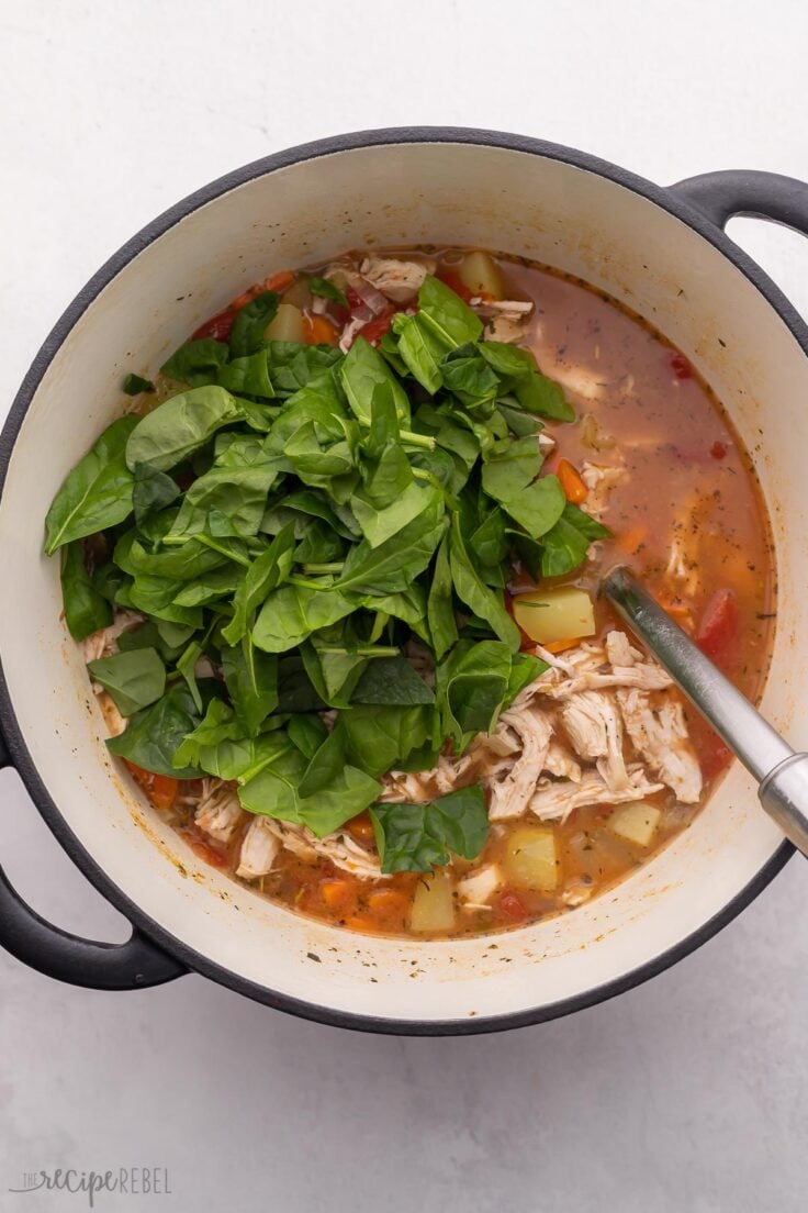 spinach added to large soup pot.