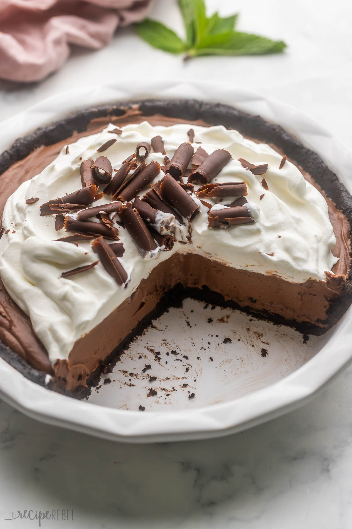French silk pie in pit plate with pieces removed.