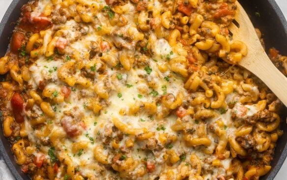 a full pan filled with homemade hamburger helper and topped with chopped parsley.