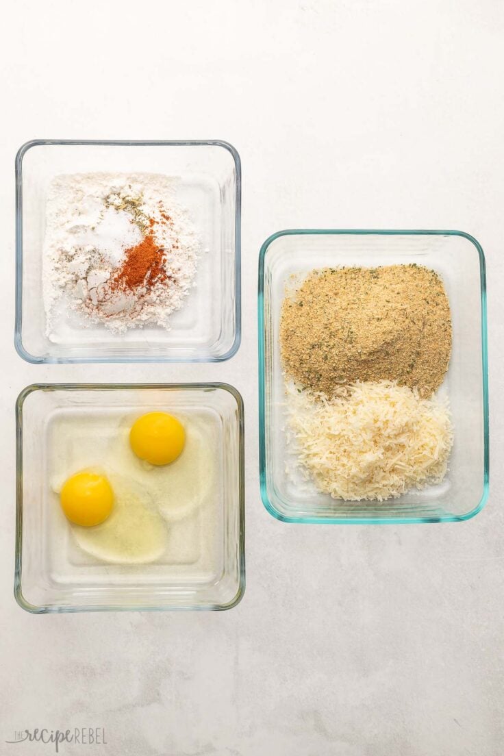 glass containers on grey surface with breading ingredients.