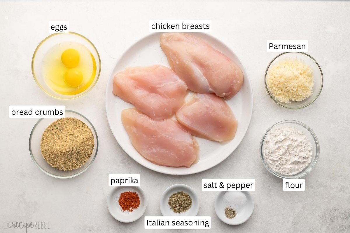 ingredients needed for parmesan crusted chicken in bowls and plate.