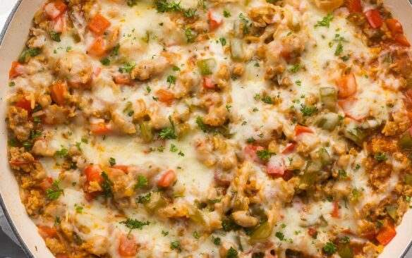 close up of stuffed pepper casserole in white dish.