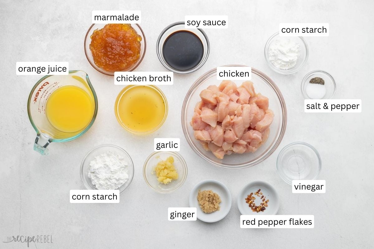 ingredients needed for orange chicken in glass bowls.