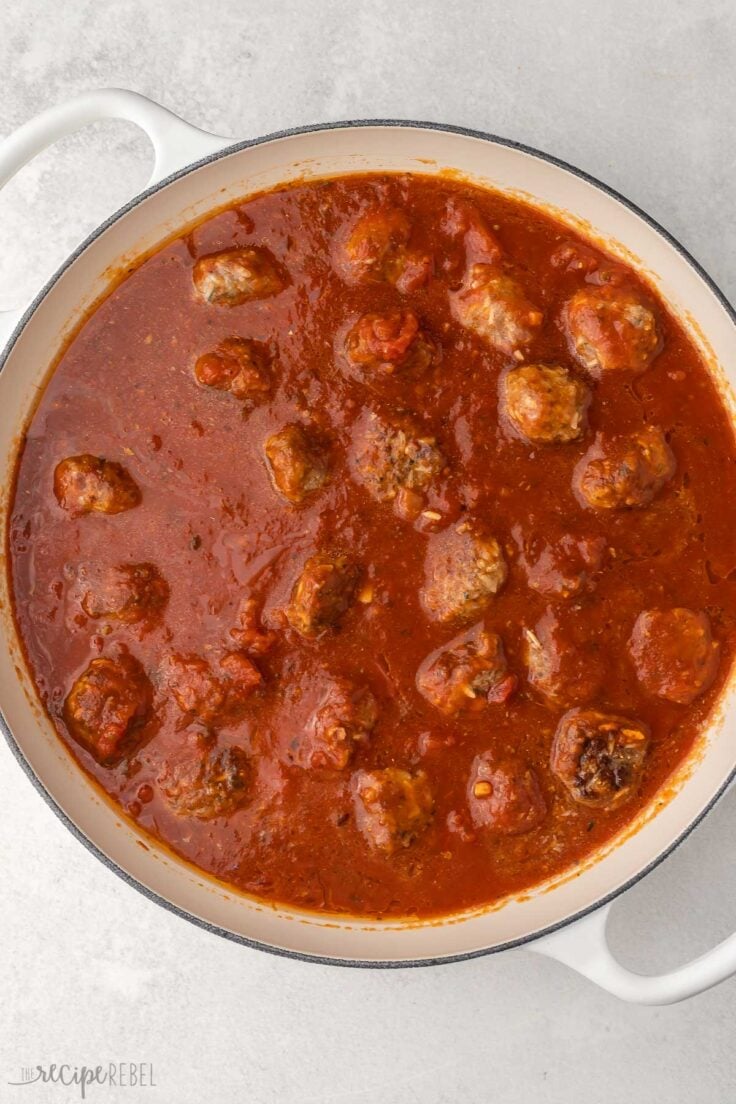 large white pan full of porcupine meatballs.