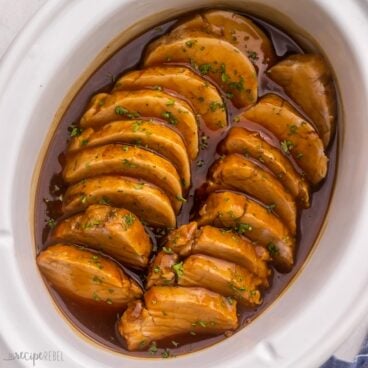 close up of sliced pork tenderloin in honey garlic sauce.