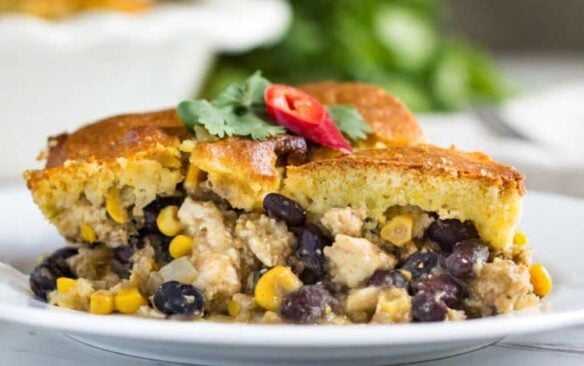 Chicken tamale pie is on a white plate.