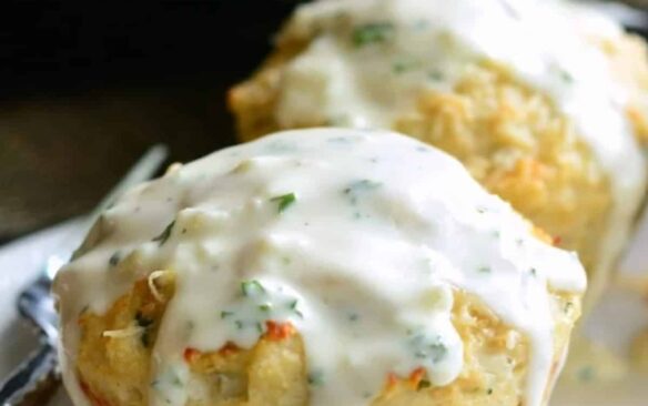 Mini chicken meatloaves are covered with cream sauce.