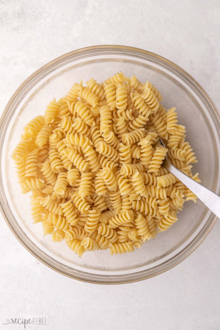 glass bowl full of cooked pasta.