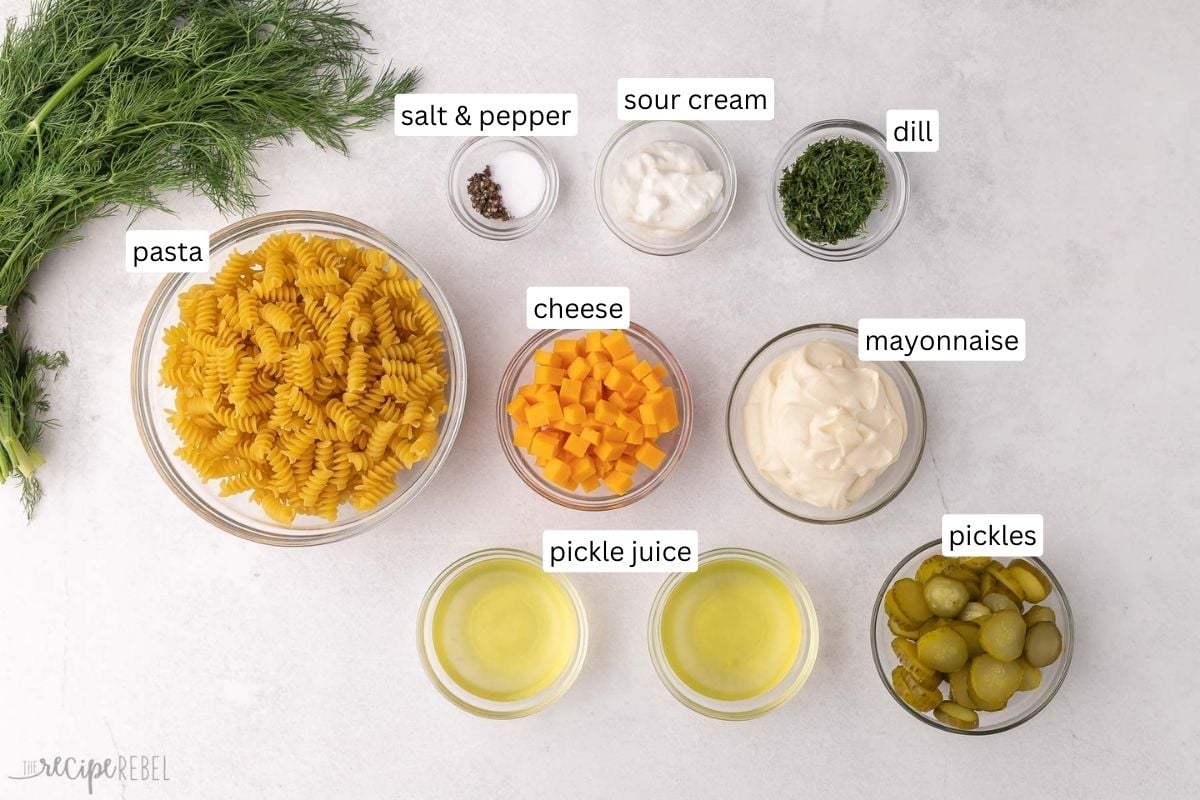 ingredients needed for dill pickle pasta salad in glass bowls.