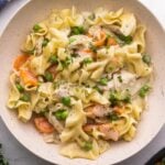 speckled bowl filled with one pan chicken and noodles.