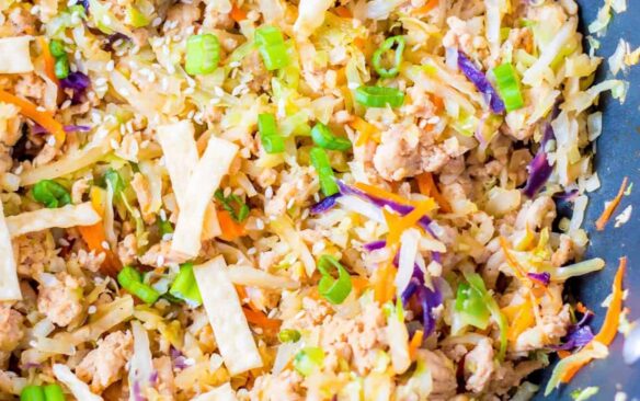 Chicken egg roll in a bowl is topped with crunchy fried wontons.