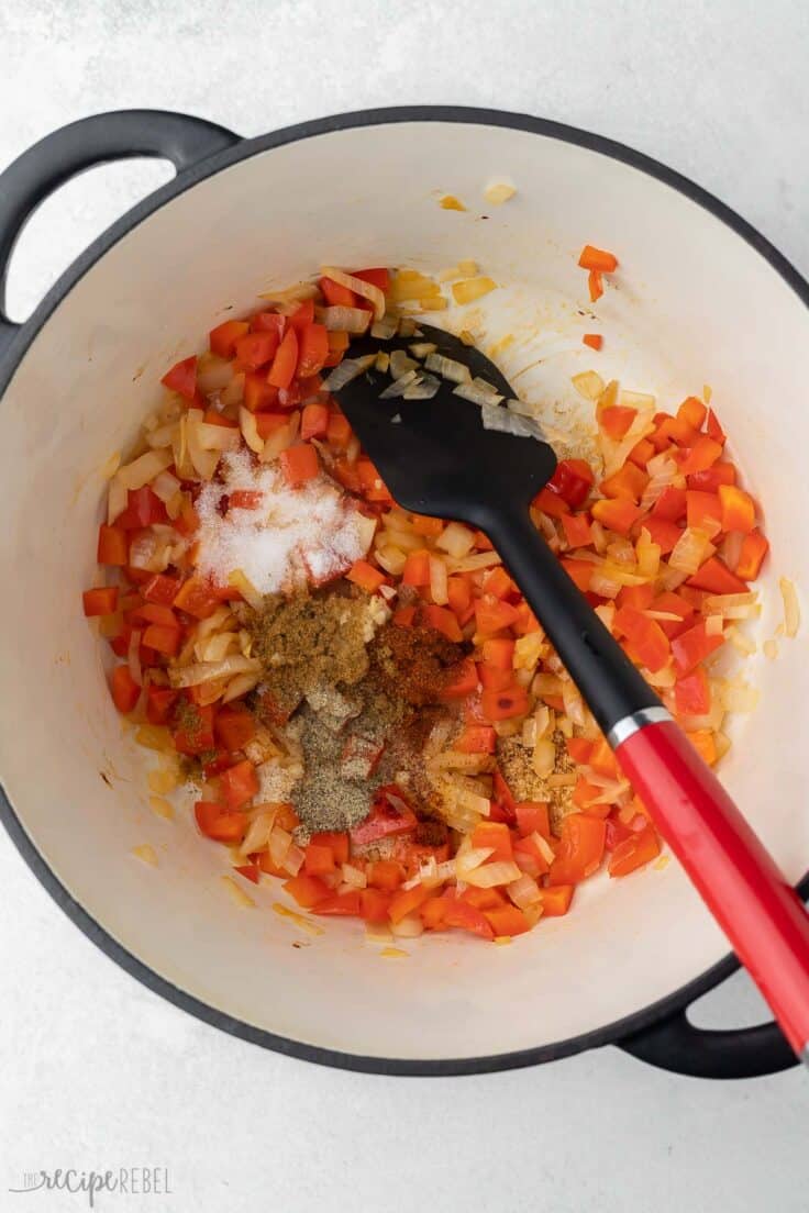 chopped vegetables and spices sauteeing in large pot.