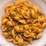 grey and white plate filled with cheeseburger pasta.