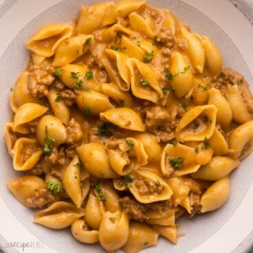 grey and white plate filled with cheeseburger pasta.