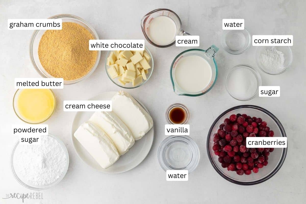 ingredients needed for no bake white chocolate cranberry cake in bowls and plate.