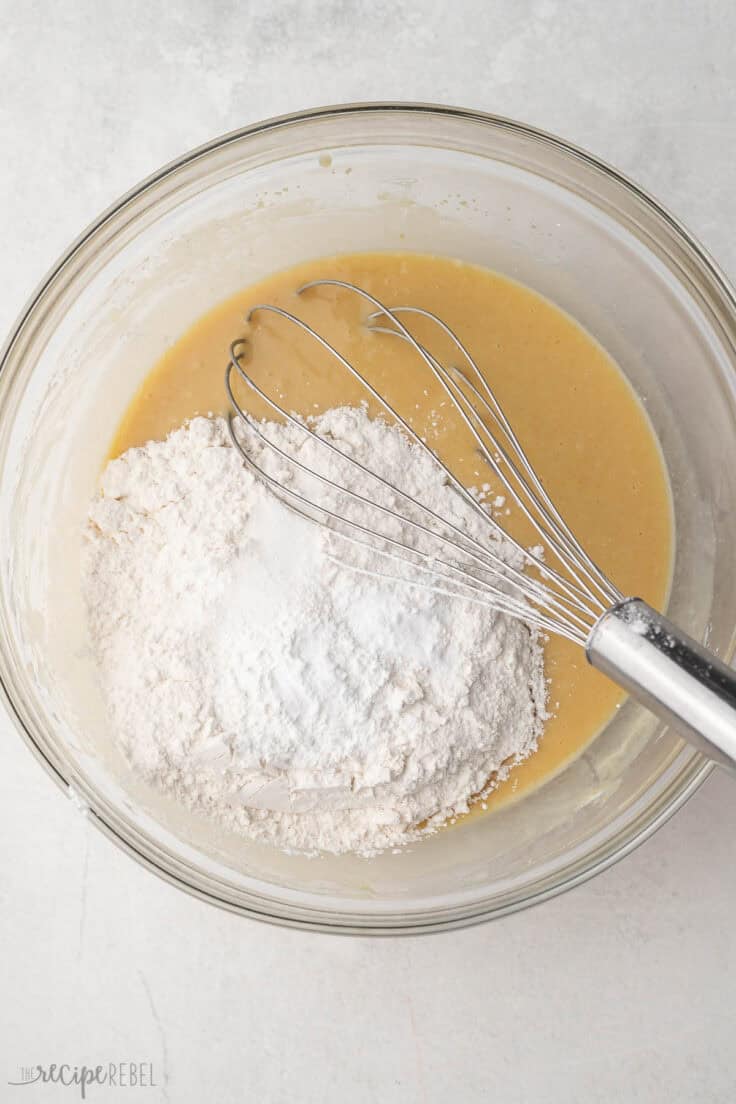 flour added to bowl of wet ingredients and steel whisk.
