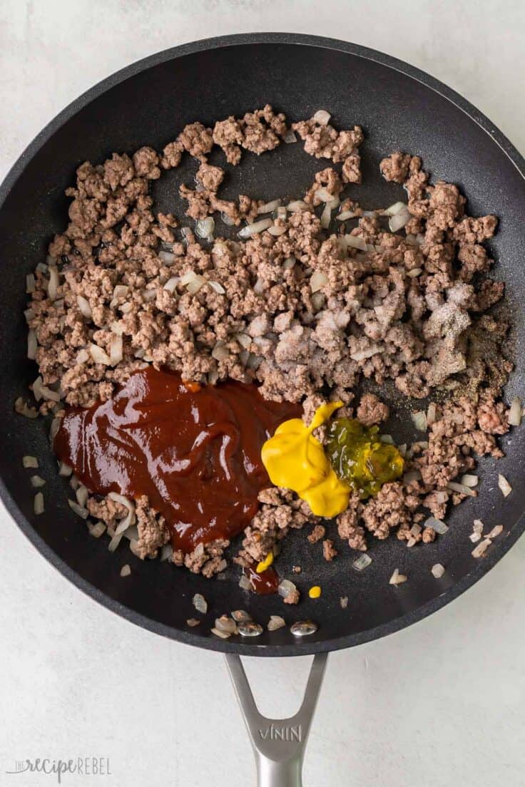 sauces added to pan of cooked ground beef.