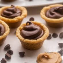 close up of a fudge puddle with chocolate chips beside.