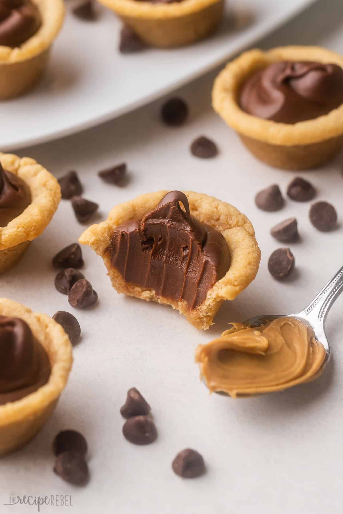 a half eaten fudge puddle with a spoonful of peanut butter beside.