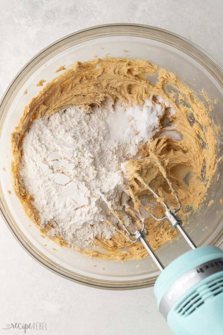 flour added to mixed ingredients in mixing bowl.