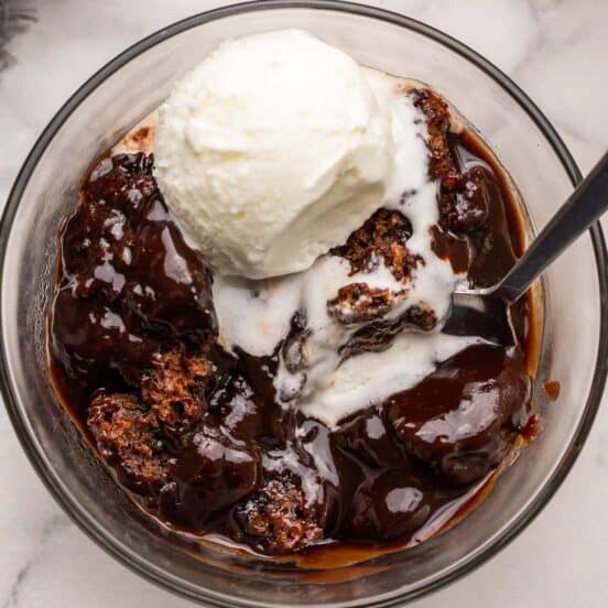 hot fudge sundae cake and vanilla ice cream in a bowl.