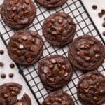 square image of moms chocolate chip cookies on a black cooling rack.
