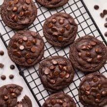 square image of moms chocolate chip cookies on a black cooling rack.
