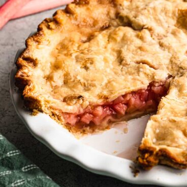 rhubarb pie with a slice cut out