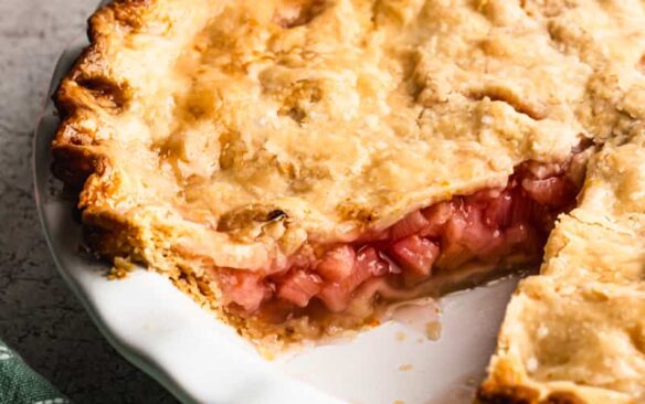 rhubarb pie with a slice cut out