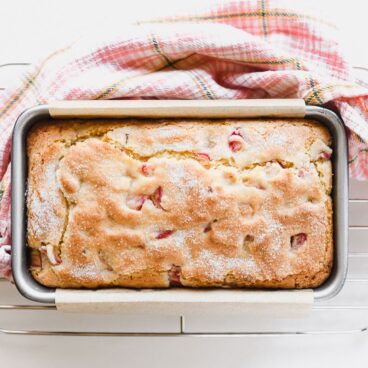 baked rhubarb bread inside of a loaf pan