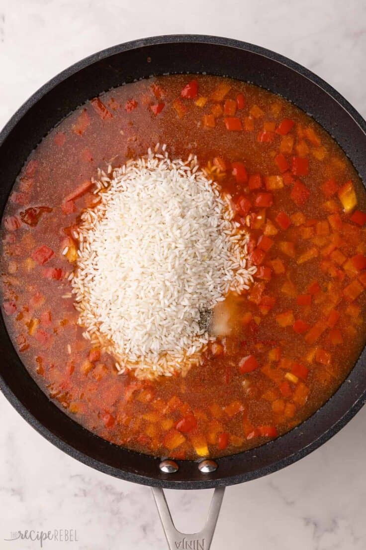 rice added to pan with other ingredients.