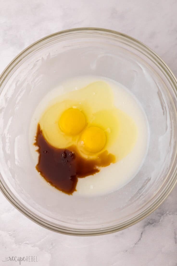 wet unmixed ingredients in glass mixing bowl.