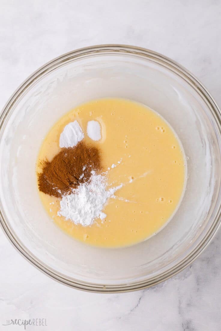 cinnamon and other ingredients added to mixing bowl.
