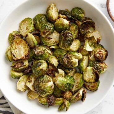 white bowl filled with air fried Brussels sprouts