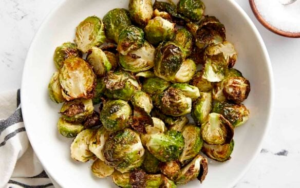 white bowl filled with air fried Brussels sprouts