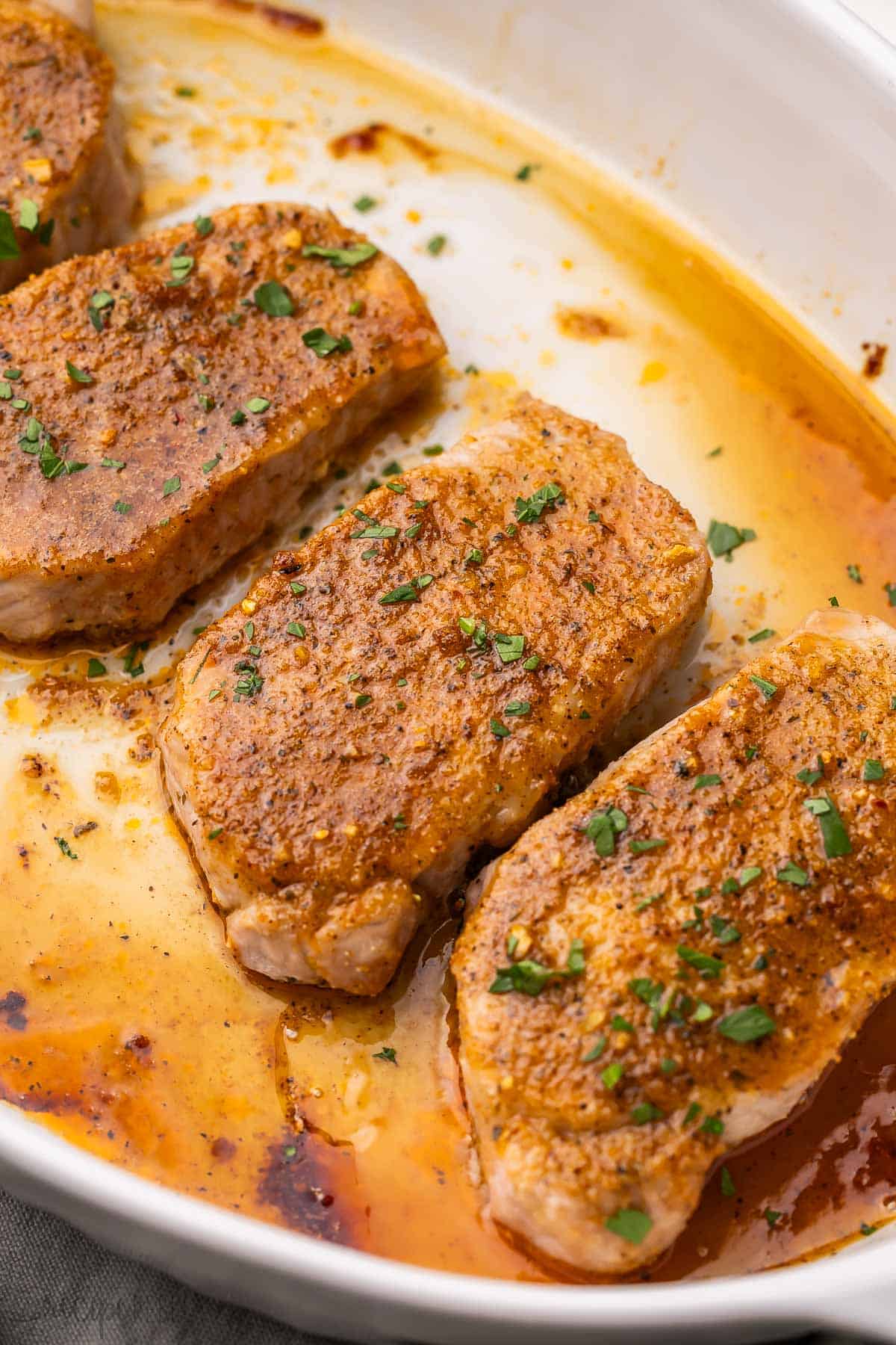 chopped parsley sprinkled on baked pork chops.