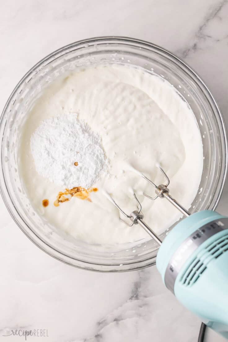 cream and other ingredients in glass mixing bowl.