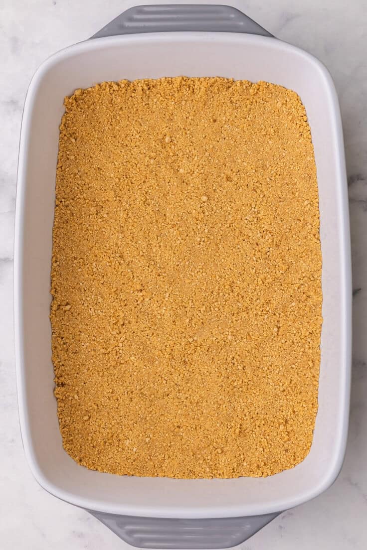 graham crumb crust pressed into white dish.
