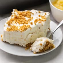 a piece of pineapple dessert with a forkful beside.