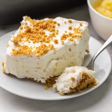 a piece of pineapple dessert with a forkful beside.