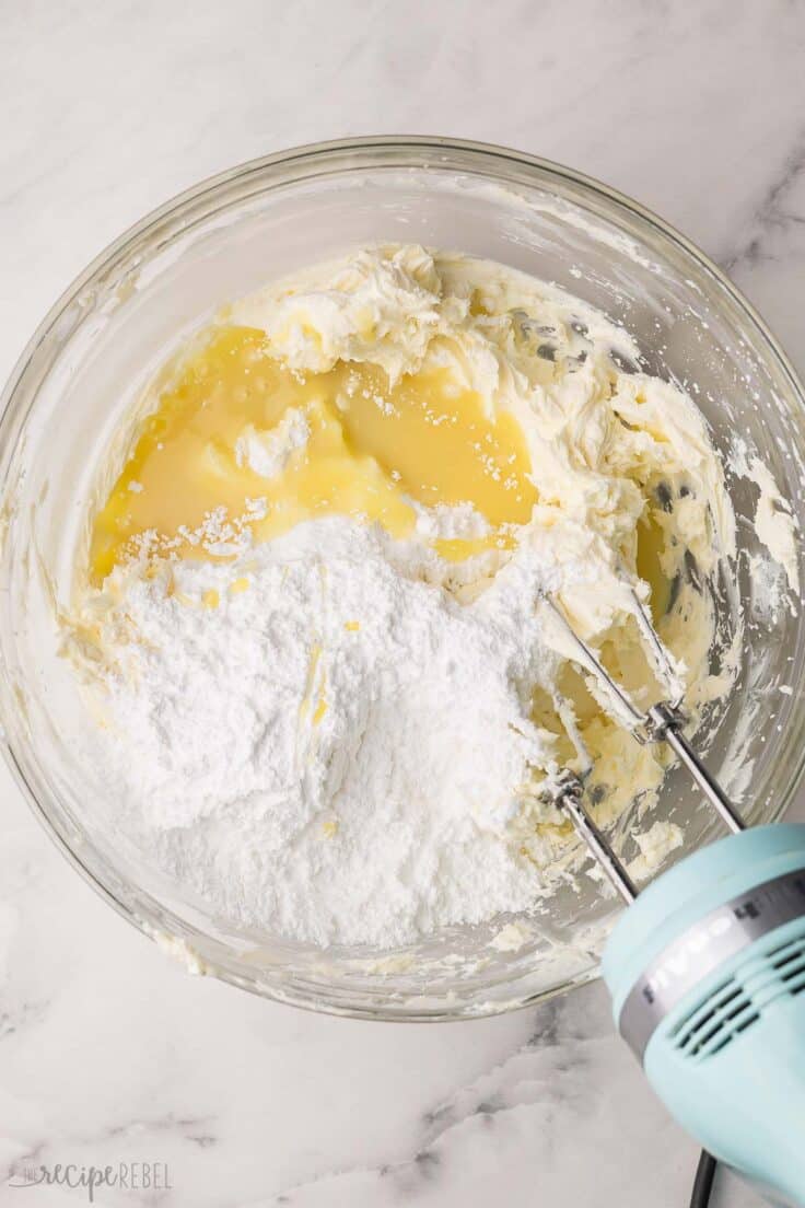 ingredients added to bowl of mixed cream cheese.
