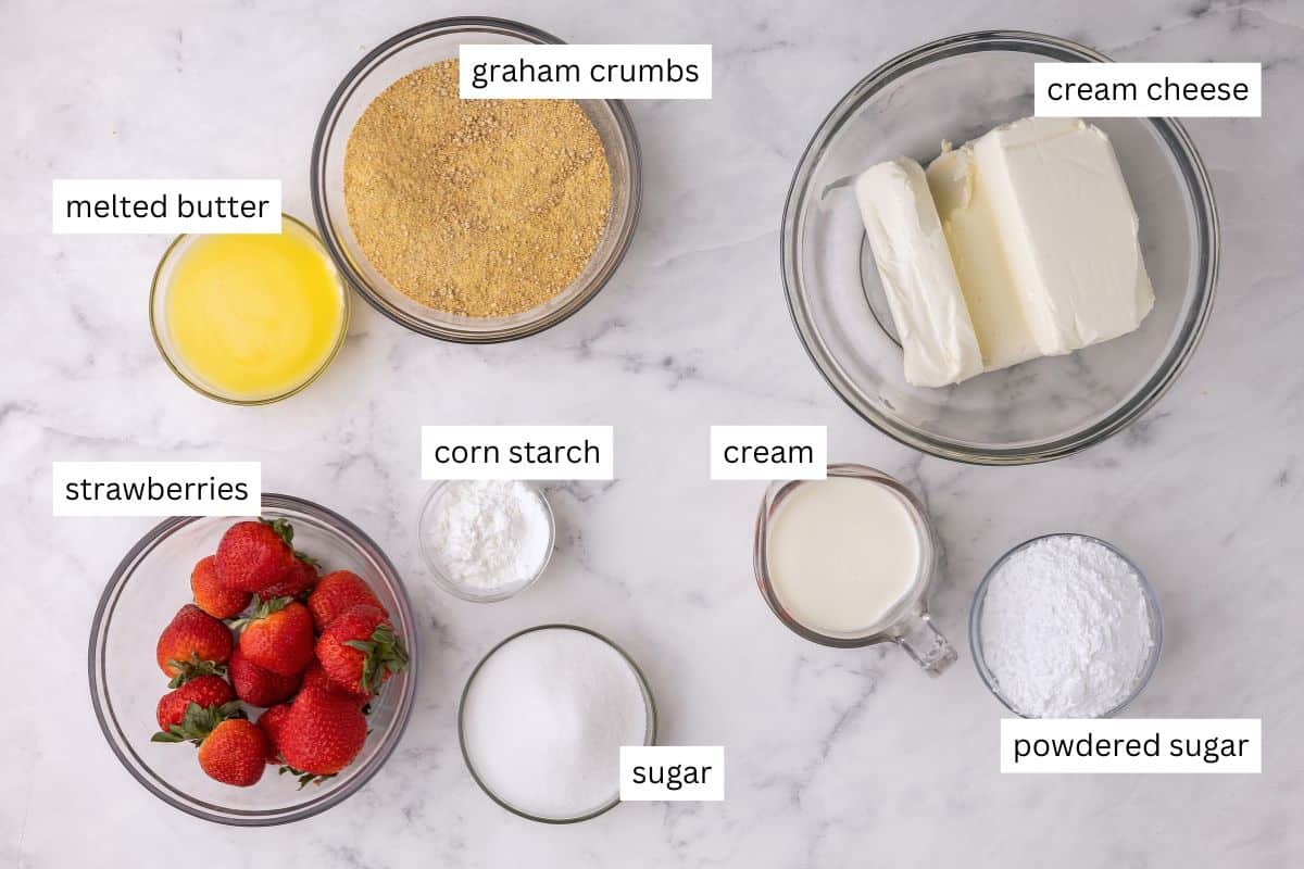 ingredients needed for no bake strawberry cheesecake in bowls.