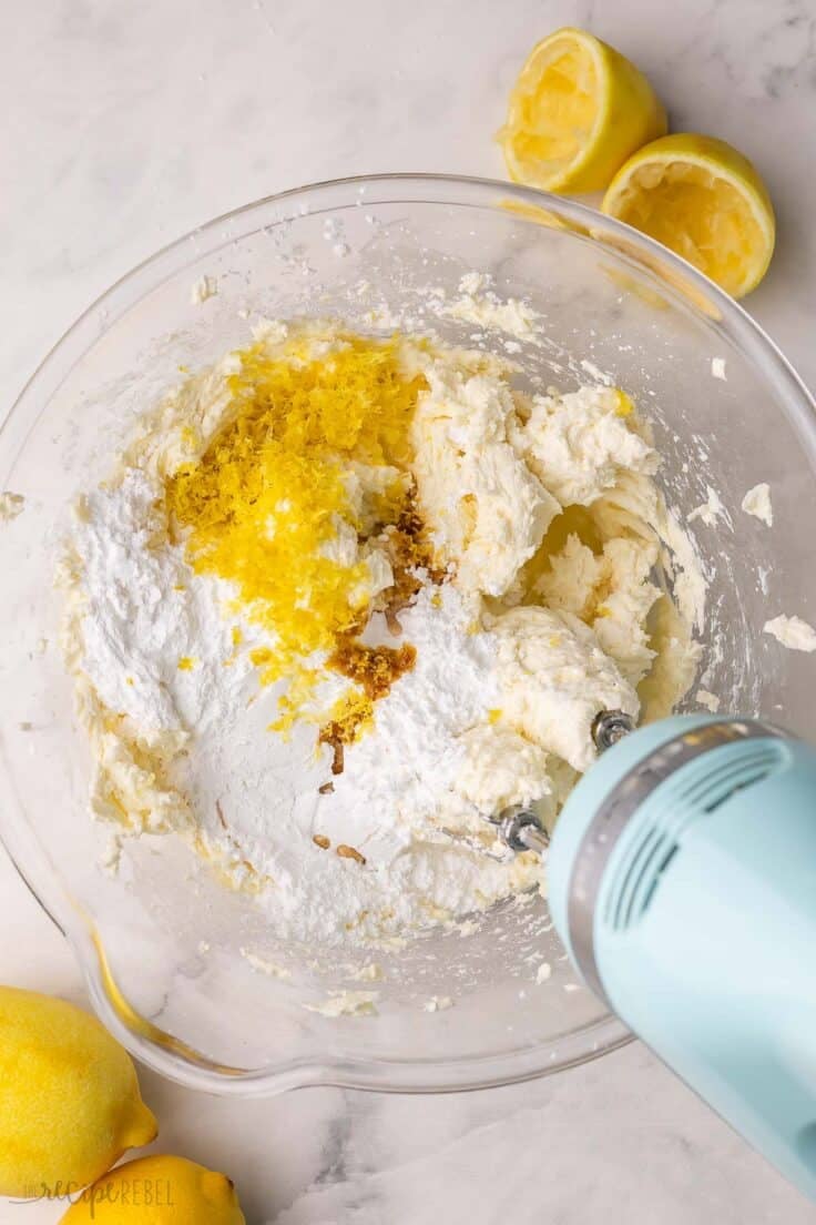 lemon zest added to cream cheese and other ingredients in bowl.
