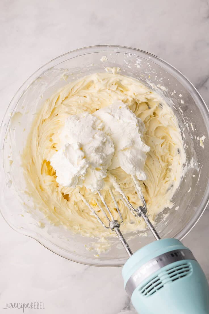 whipped cream added to bowl of cream cheese mixture.