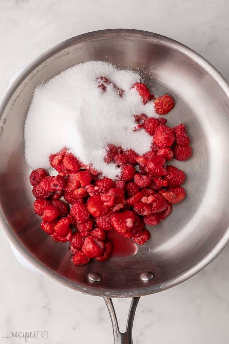 raspberries and sugar added to pan.