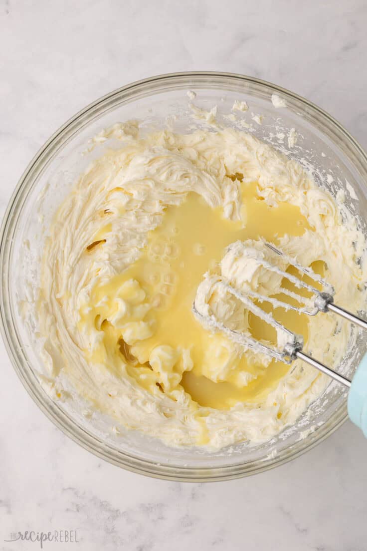 melted white chocolate added to beaten cream cheese.