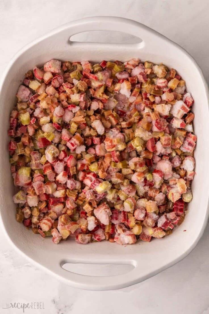 white baking dish filled with rhubarb.