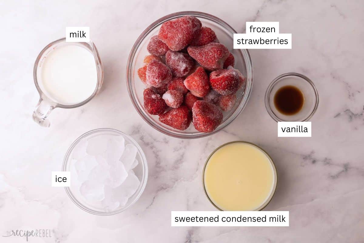 ingredients needed for strawberry frappuccino in bowls.